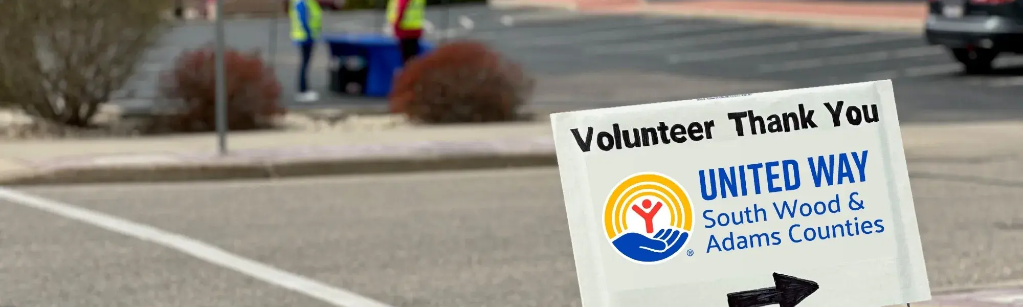 Yard sign that says "Volunteer Thank You" and the United Way of South Wood & Adams Counties logo